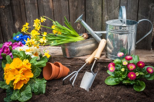 Seasonal weeding and mulching in a Bloomsbury garden bed